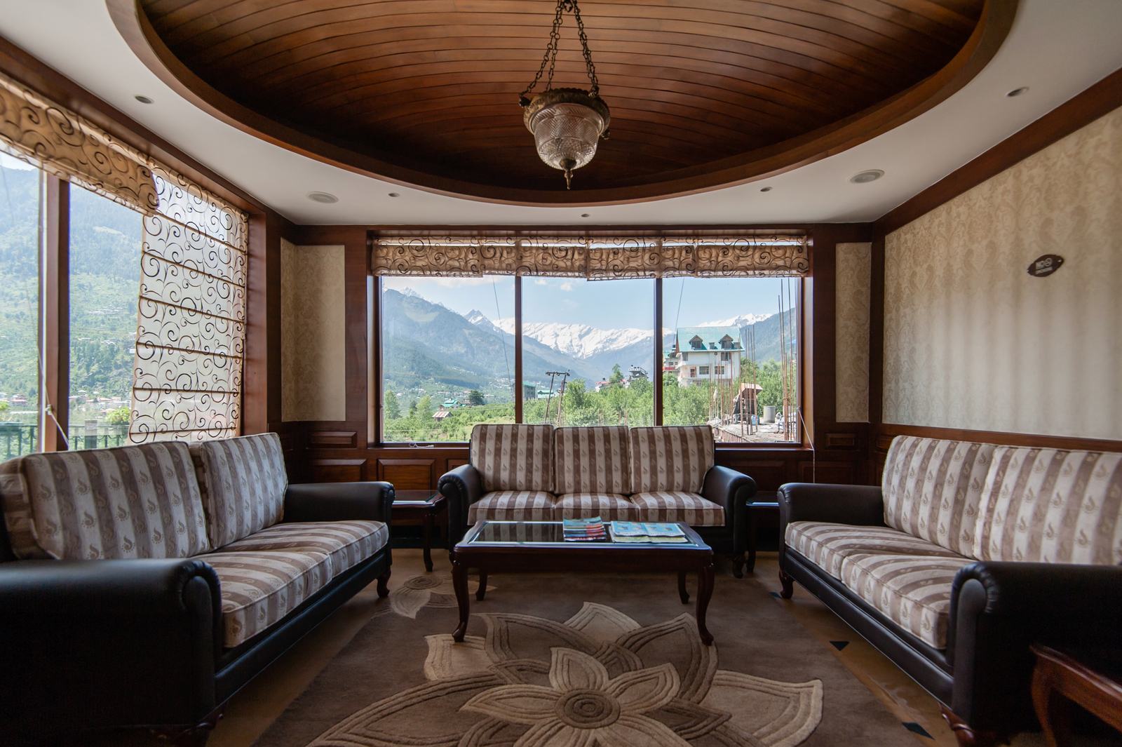 Lounge with wide windows facing the mountains