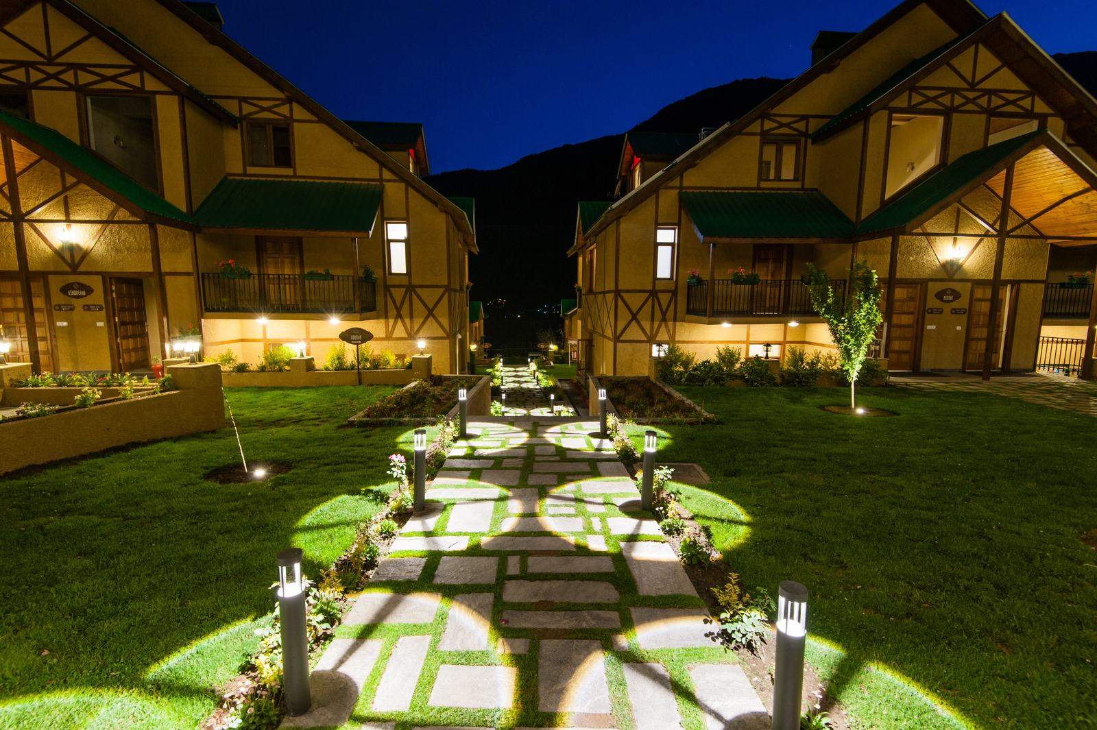Lit path between villas