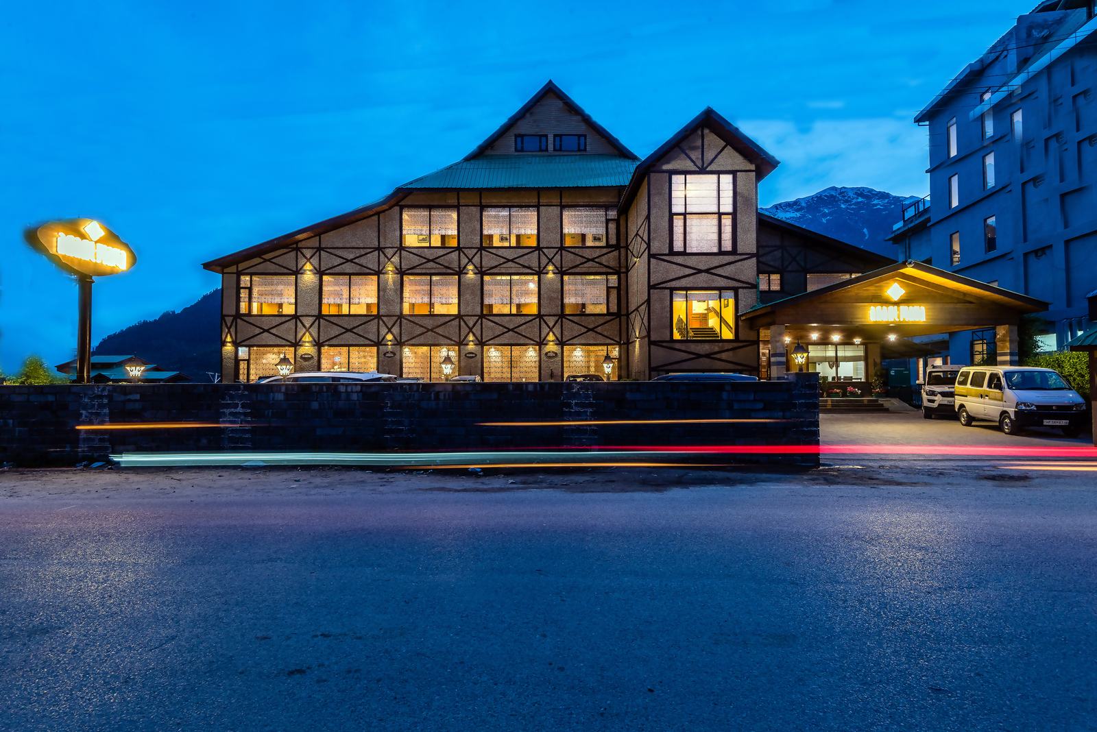 The main block seen from the road at dusk