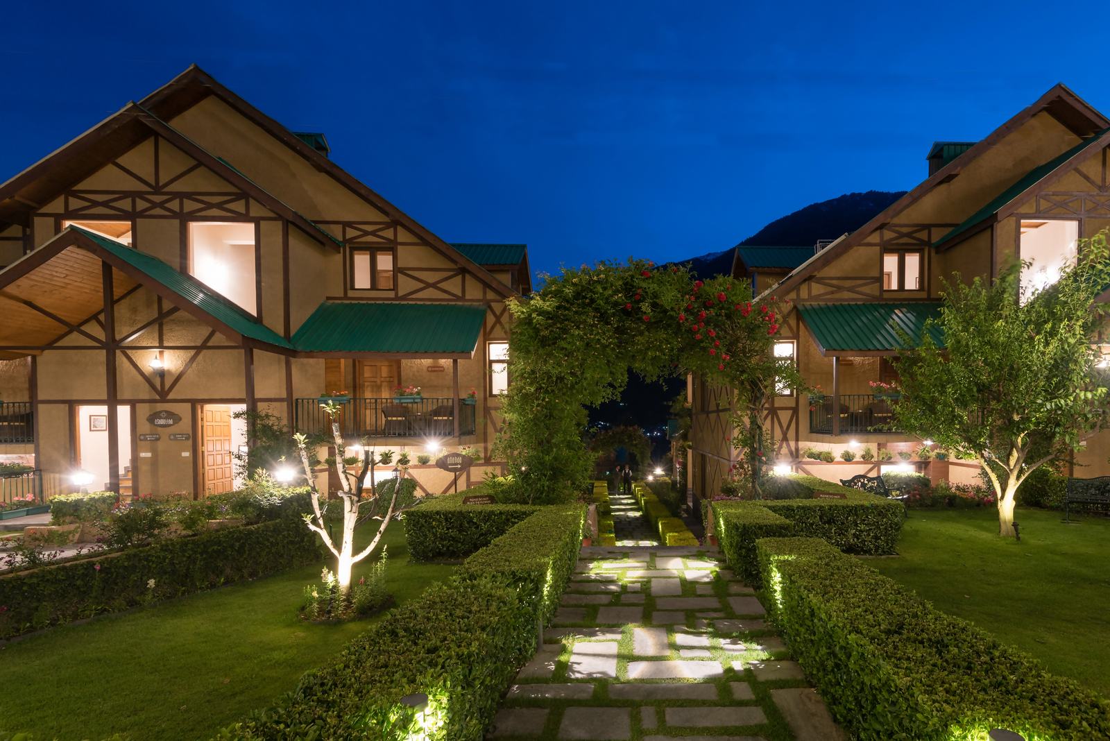 Lit path between cottages