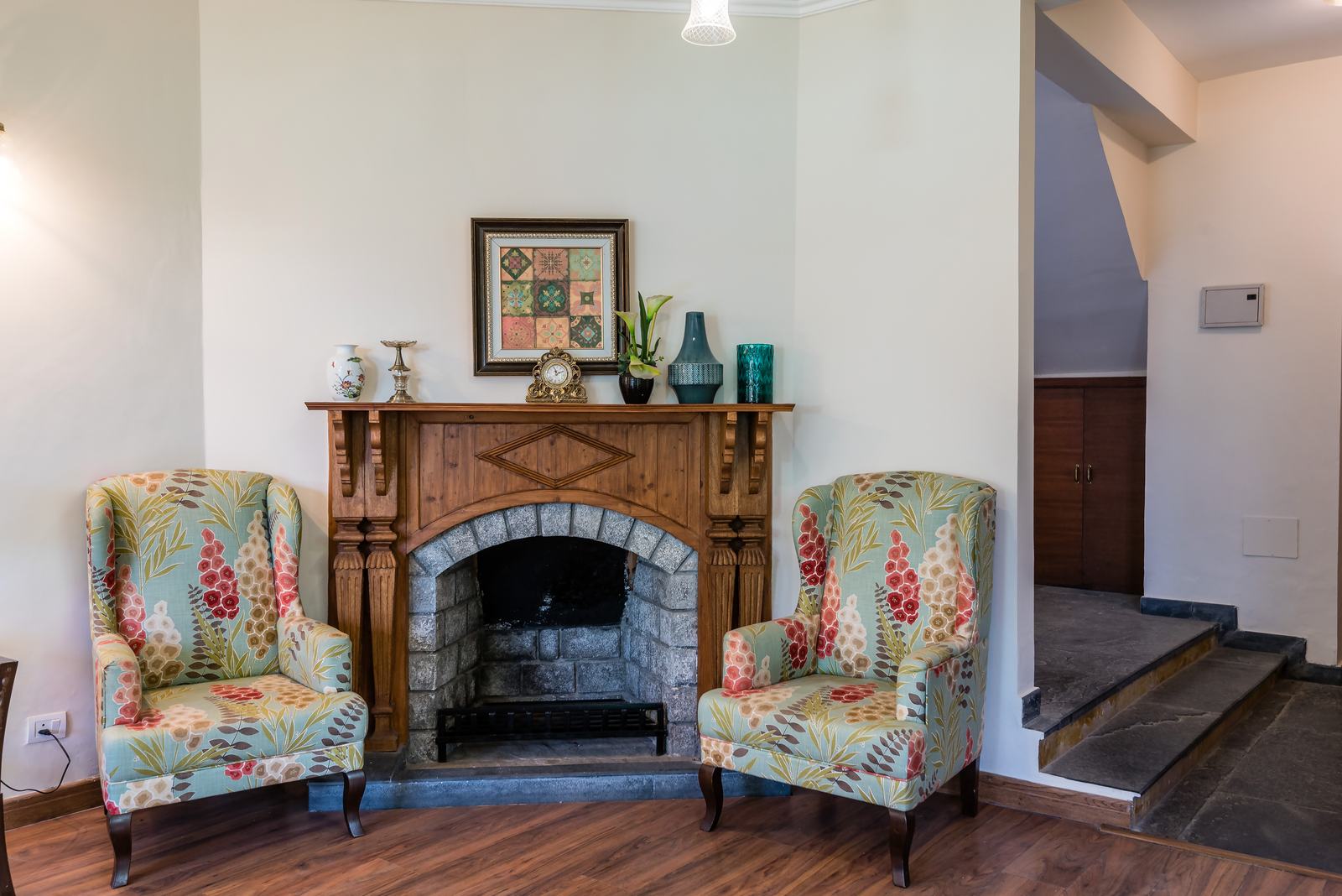 Fireplace with two armchairs