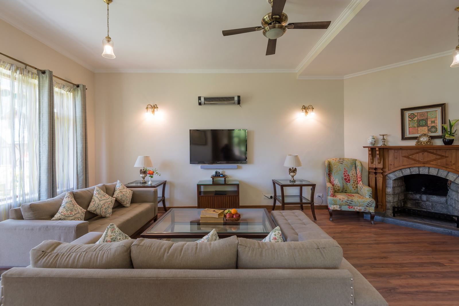Villa living room with sofas and fireplace
